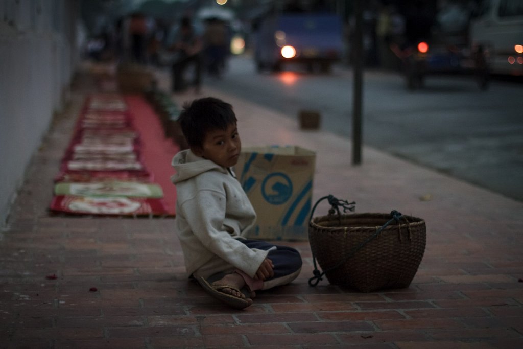 boy waiting for alms